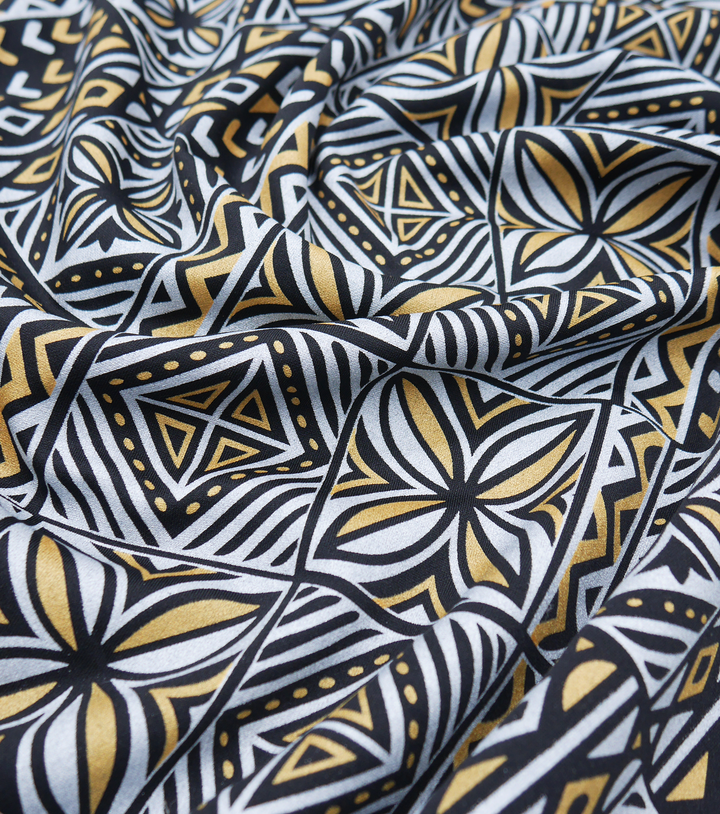Stretch Polyester Pacific Print $12.00p/m Design #21 - Black, Silver & Gold