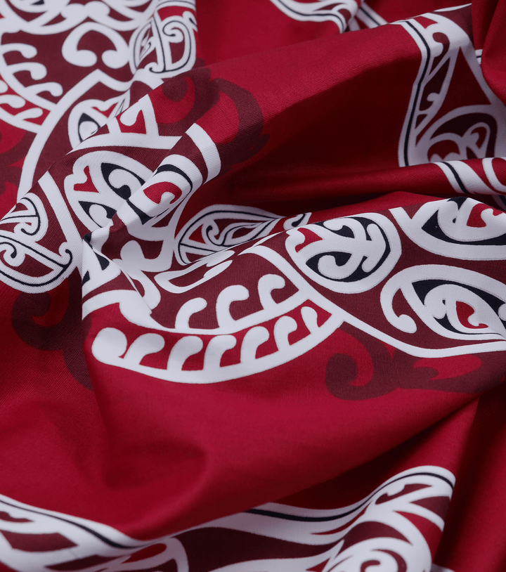 COTTON MAORI KORU DESIGN $8.00P/M - maroon - The Fabric Shop