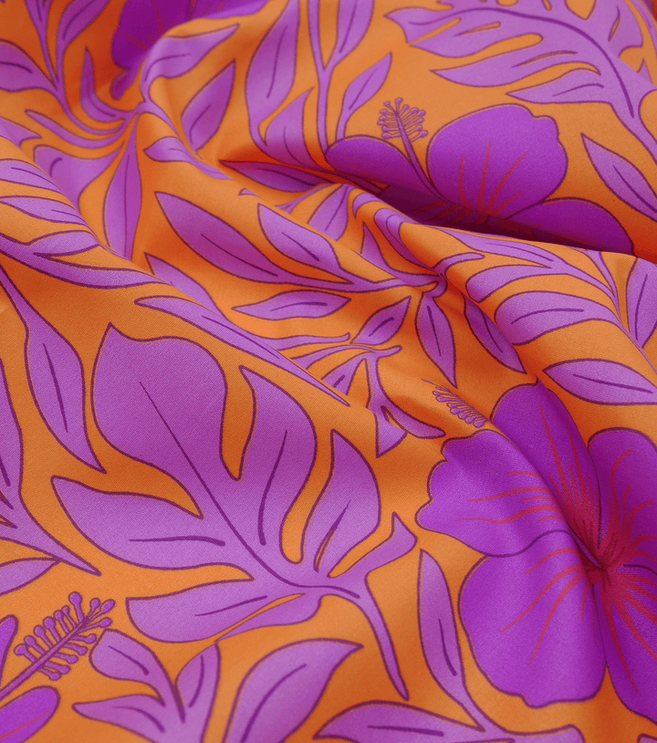 POLYESTER / COTTON PACIFIC PRINT $3.00P/M - ORANGE &amp; PURPLE - The Fabric Shop
