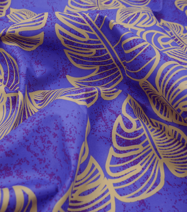 POLYESTER / COTTON PACIFIC PRINT $3.00P/M - purple &amp; gold - The Fabric Shop