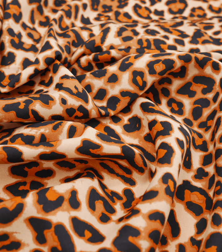 PRINTED POLYESTER $5.00P/M - Wild Ember Leopard - The Fabric Shop