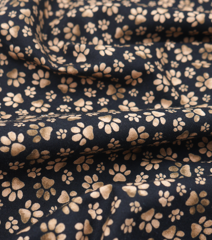 Craft Cotton $10.00p/m Dog Paws Black and Brown