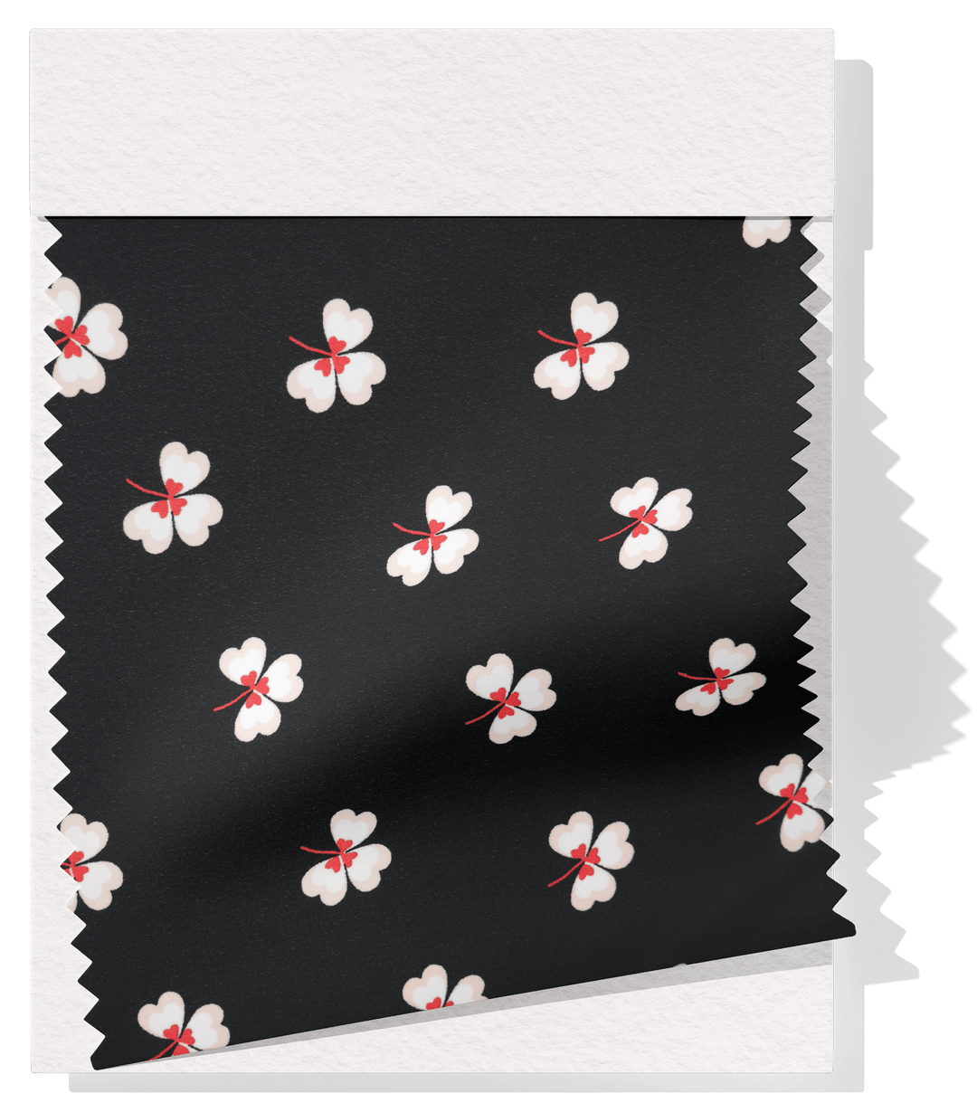 Printed Polyester $5.00p/m - Black w/ white flower (Online Only) - The Fabric Shop