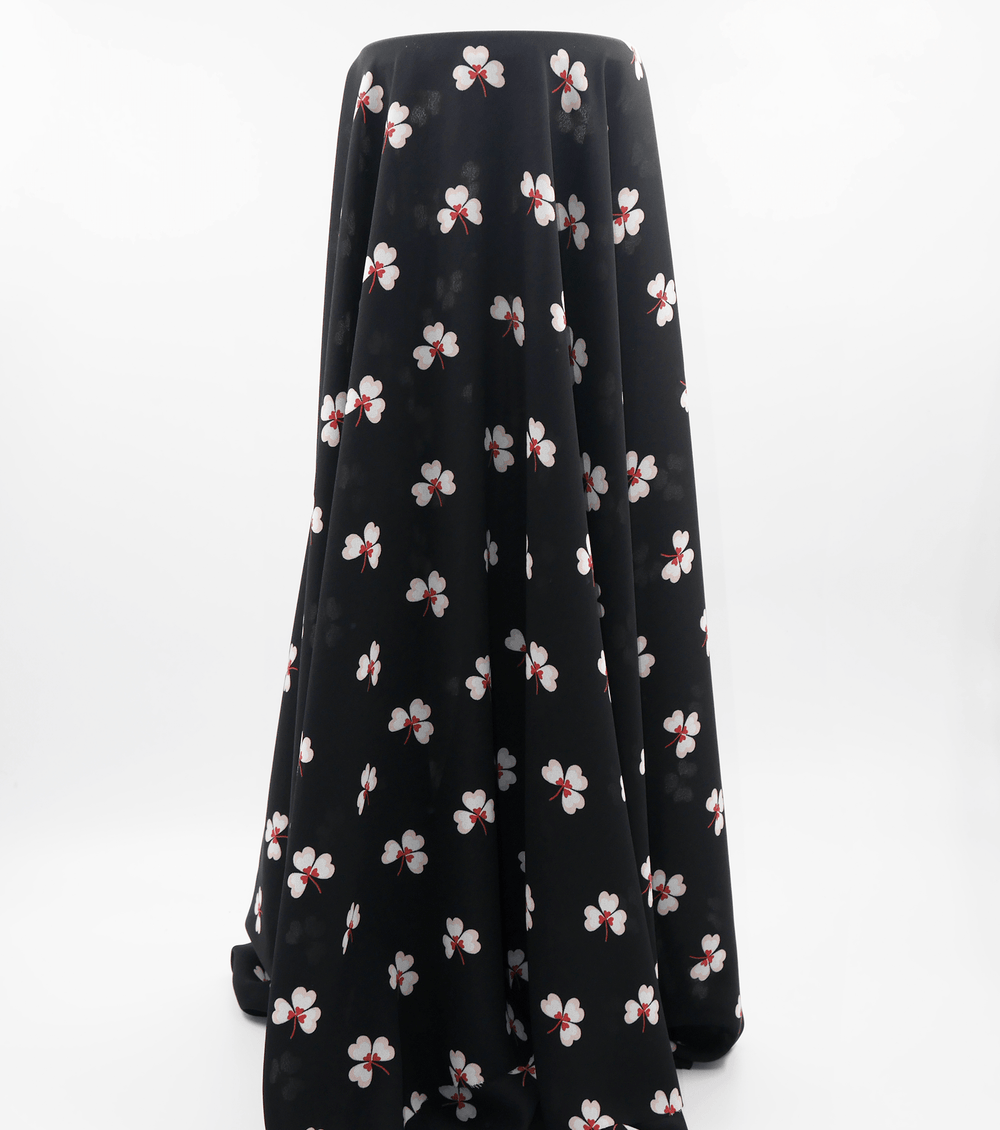 Printed Polyester $5.00p/m - Black w/ white flower (Online Only) - The Fabric Shop