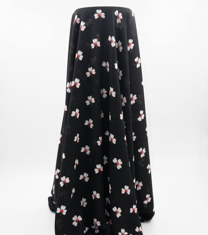 Printed Polyester $5.00p/m - Black w/ white flower (Online Only) - The Fabric Shop